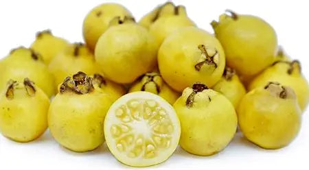 Lemon Cattley guava cut open to show its flesh and seeds