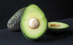 Super Hass avocado cut open to show its flesh and seed