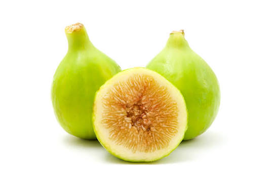 Yellow Thailand Honey fig cut open to show honey-colored flesh